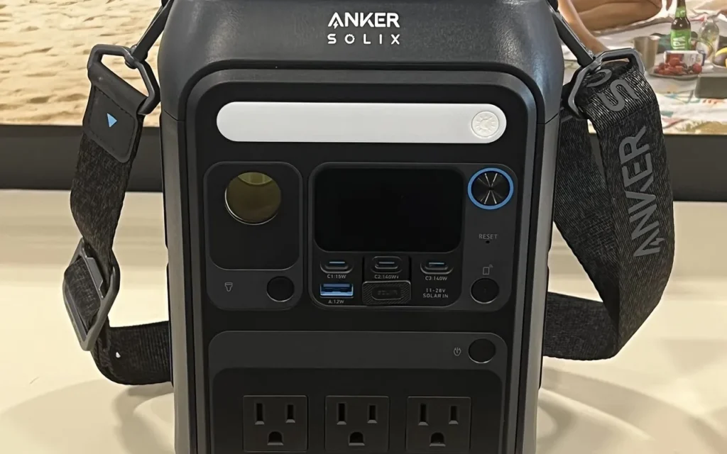 An Anker SOLIX C300X portable power station with three AC outlets, USB ports and a solar input