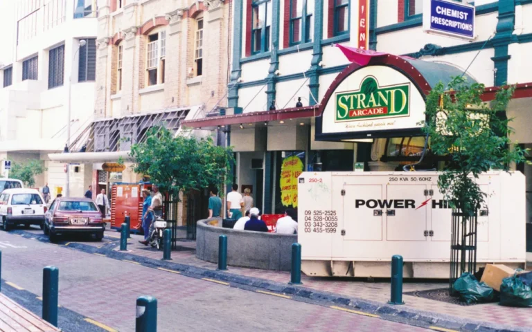 Can I Run a Portable Generator in the Rain? A generator set up on a city street during a power outage