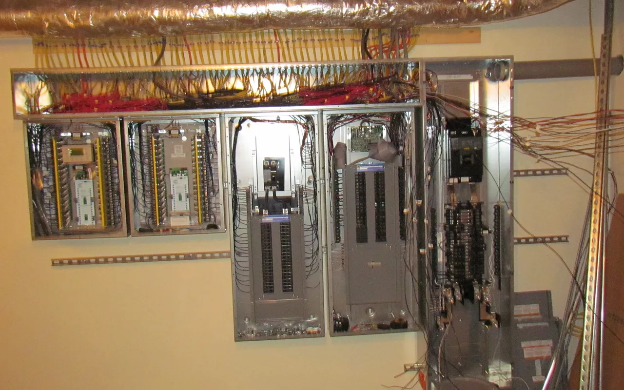 A residential electrical panel with breakers and wiring