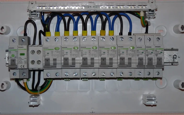 Do Standby Generators Come with an Automatic Transfer Switch? An open residential electrical panel with a row of circuit breakers and neatly routed wires