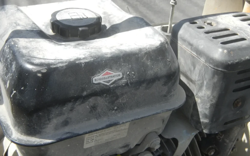 Close-up of a Briggs and Stratton small engine fuel tank and cap