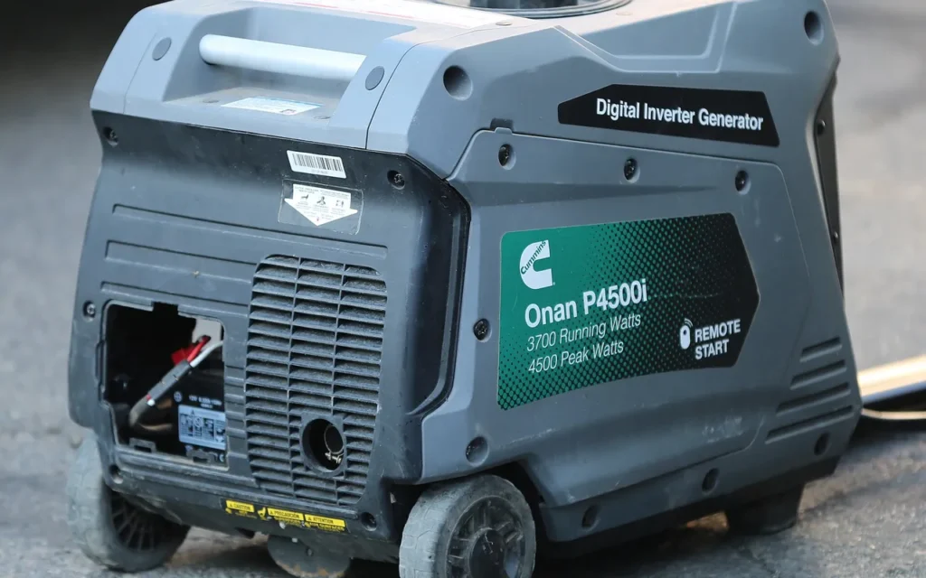 A Cummins Onan P4500i inverter generator on pavement