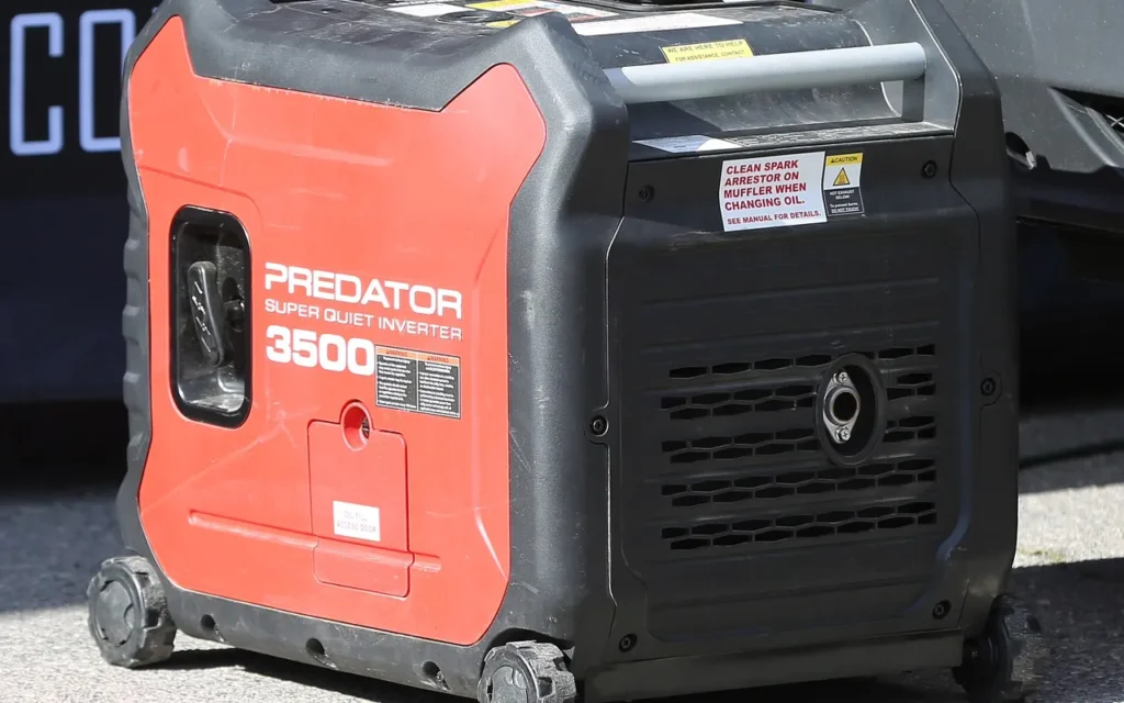 A red Predator 3500 inverter generator, a portable unit often used for camping
